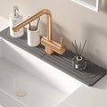 Diatomite kitchen sink splash guard behind faucet by Unknown